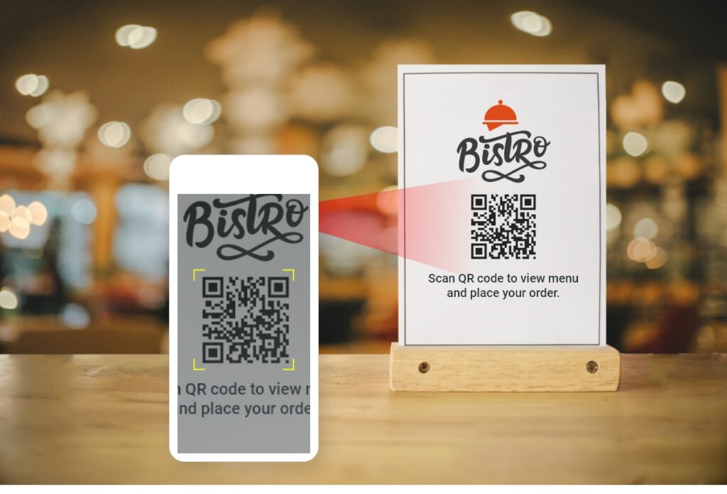 Self Ordering system - a phone scanning a QR code at a table